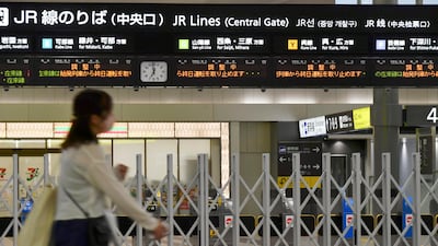 A person walks past closed ticket gates at a train station in Hiroshima, western Japan. AP