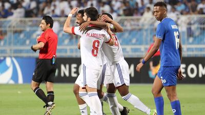 Sharjah's players celebrate scoring their second goal against Hilal.
