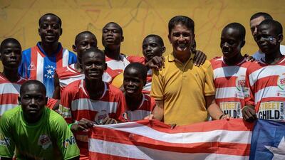 Liberian players pose with Brazilian former football player Jose Roberto Gama de Oliveira aka Bebeto (yellow) during the second edition of the Street Child World Cup in Rio de Janeiro, Brazil, on Tuesday. Yasuyoshi Chiba / AFP / April 1, 2014