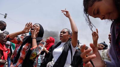 Protesters angry at the military's seizure of power in October chant slogans. AFP