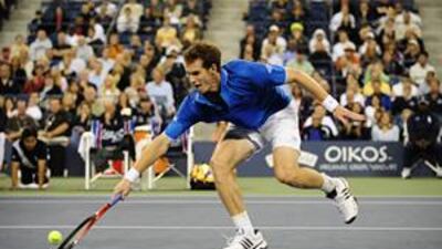 Andy Murray, the world No 2, returns a point during his one-sided match against Taylor Dent on Sunday.