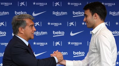 Former Manchester City's player Eric Garcia wit Barcelona president Joan Laporta during his official presentation as new Barca player at Camp Nou. AFP