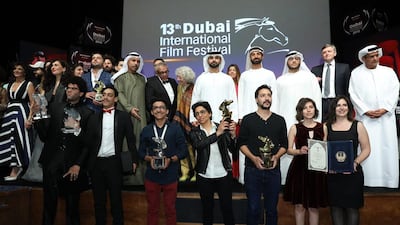 Sheikh Mansoor bin Mohammed bin Rashid (C) with award winners during the Muhr Awards on day eight of the 13th annual Dubai International Film Festival held at the Madinat Jumeriah Complex. Neilson Barnard / Getty Images