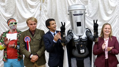 Count Binface, a character created by comedian Jon Harvey, waits with other candidates for the declaration of the results of the Clacton by-election. Getty Images