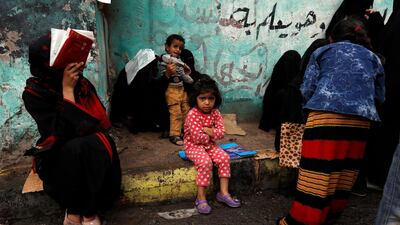 Yemenis wait to get free food rations from a charity group in Sana'a, Yemen. EPA