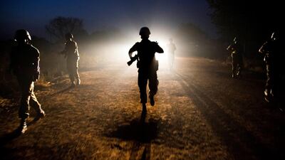 Peacekeeper troops from Ethiopia and deployed in the United Nations (UN) Interim Security Force patrol at night in Abyei town, Abyei state. (Photo by Albert Gonzalez Farran / AFP)