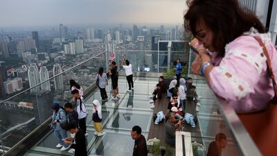 Visitors enjoy the view from the UP sky garden at the Thamrin Nine building, 385 metres above Jakarta, Indonesia. Reuters