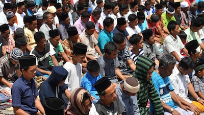 Indonesian Muslims perform congregational Friday prayers on a field near temporary shelters in Pemenang, northern Lombok. AFP