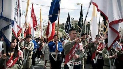 Palestinian youth scouts lead the traditional Palm Sunday procession from the Mount of Olives to Jerusalem's Old City.