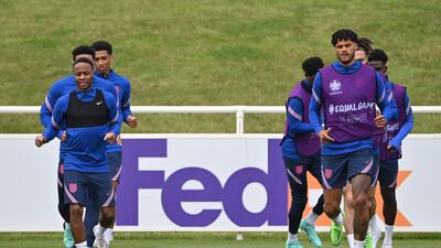 Raheem Sterling, left, and defender Tyrone Mings, right.