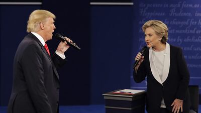 Donald Trump and Hillary Clinton speak during the second presidential debate at Washington University, St Louis, on October 9, 2016. John Locher/AP Photo