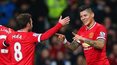 Marcos Rojo of Manchester United celebrates with Juan Mata after scoring the team's second goal on Tuesday. Alex Livesey / Getty Images