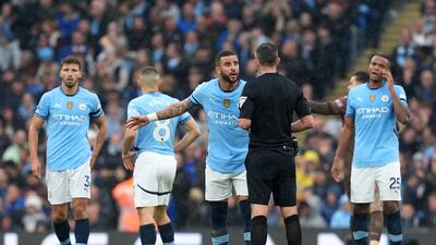 Manchester City's Kyle Walker argues with referee Michael Oliver after Riccardo Calafiori's goal for Arsenal. PA