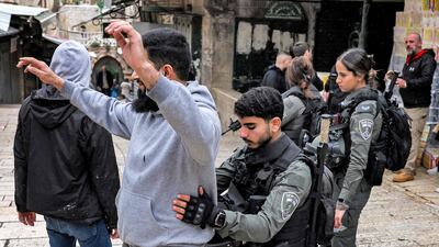 A Palestinian man is searched on Wednesday in the Old City of Jerusalem, where tensions are mounting after the killing of a senior Hamas official. AFP