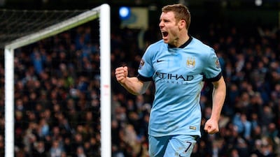 Liverpool-bound James Milner is pictured scoring for Manchester City, the fourth biggest brand in world football, giving full exposure to club sponsor Etihad Airways. Oli Scarff / AFP