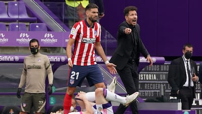 Atletico Madrid's coach Diego Simeone alongside Yannick Ferreira-Carrasco. AFP
