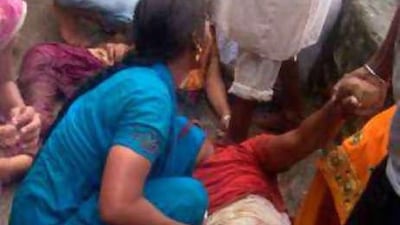 Iron railings leading to the Hindu temple broke, causing the stampede, senior police officers said.