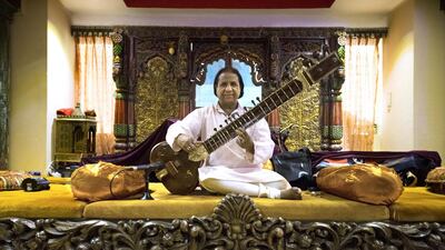 A musician plays the sitar at the Arabian Courtyard Hotel. Christopher Pike / The National