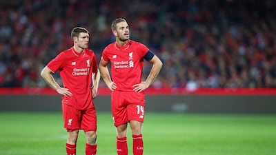 The new leaders of Liverpool, captain Jordan Henderson, right, and vice-captain James Milner, left, will have big parts to play this season. Matt King / Getty Images