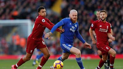 Cardiff City's Aron Gunnarsson in action with Liverpool's Trent Alexander-Arnold and Adam Lallana. Reuters