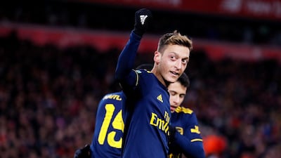 Arsenal's Mesut Ozil celebrates their fourth goal. Reuters