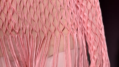 Hand-stitched seams create a ripple effect on a Valentino gown. Photo by Pascal Le Segretain / Getty Images