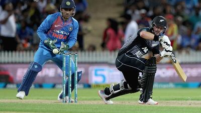Opener Colin Munro, right, top-scored for New Zealand against India on Sunday. David Rowland / AP Photo