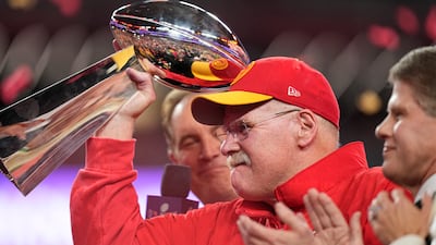 Kansas City Chiefs head coach Andy Reid holds the Vince Lombardi Trophy. AP