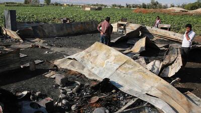 The remains of a home where several Pakistani farmers were killed in a fire in the town of Shuna in Jordan. AFP