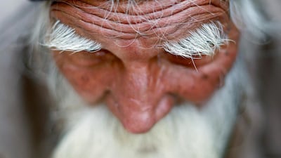 A farmer listens during a protest against soaring farm operating costs and plunging prices of farm produce, in New Delhi, India. Reuters