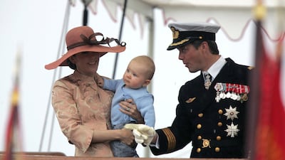 Crown Princess Mary, Crown Prince Frederik and their son, Prince Christian, wave to the crowd at Ronne, Denmark at their arrival on board the royal danish vessel Dannebrog in 2006. AP