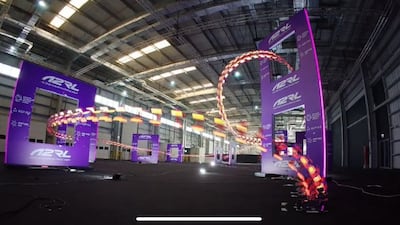 Drones fly through the course at the autonomous drone racing event in Abu Dhabi. Photo: Aspire