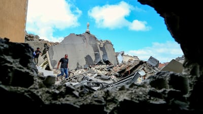 People inspect damage following an Israeli air strike in the southern port city of Tyre, Lebanon. EPA