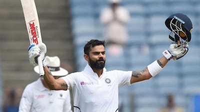 India's cricket team captain Virat Kohli celebrates after scoring a century. AFP