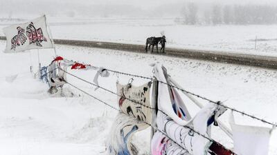 A person walks a horse past the Oceti Sakowin camp during a snowstorm during a protest against plans to pass the Dakota Access pipeline near the Standing Rock Indian Reservation, near Cannon Ball, North Dakota, US. Stephanie Keith / Reuters
