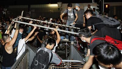 Pro-democracy protesters set up new barricades after riot police retreated from a main road at Mong Kok shopping district. Liau Chung-ren/Reuters
