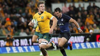 Michael Hooper of Australia runs to score a try against Argentina on Saturday. Richard Wainwright / EPA / September 17, 2016