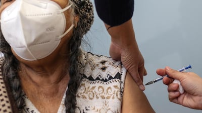 An elderly woman receives the vaccine against Covid-19 at a hospital in the state of Guanajuato, Mexico. EPA