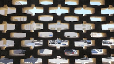 Looking out through wind grills inside a residential Bur Dubai building. Pawan Singh / The National