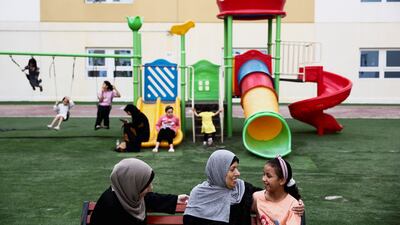 Palestinian evacuee and cancer patient Hanaa Saeed Selim, from Gaza, sits in a playground with her her daughter, who was brought from the U. S. to accompany her, during the Muslim holy month of Ramadan at Emirates Humanitarian City, in Abu Dhabi, United Arab Emirates, March 19, 2024. REUTERS / Amr Alfiky