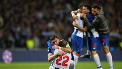 Porto's Hector Herrera, left, celebrates with Danilo Pereira after winning their Uefa Champions League last-16 second-leg match against Roma. Jose Coelho / EPA