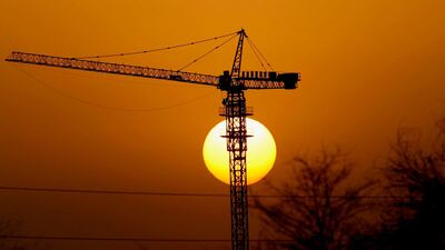 The sun sets over a construction site in Dubai. Stephen Lock / The National .