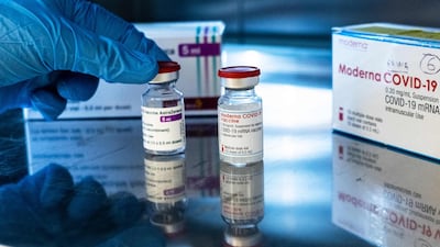 Vials of the AstraZeneca (L) and Moderna Covid-19 vaccines are pictured at the pharmacy of the Sant'Andrea hospital in Vercelli, Piedmont, Italy. AFP