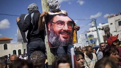 Supporters of Hizbollah leader Hassan Nasrallah. The Lebanese are divided on supporting the organisation.