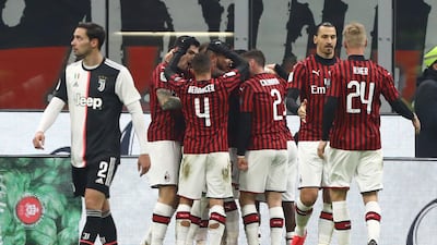 Milan's Ante Rebic celebrates with his team-mates after scoring. Getty