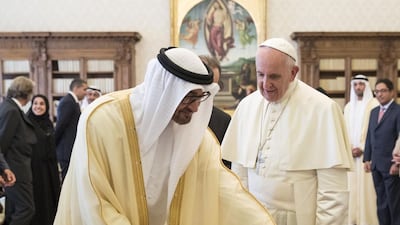 Sheikh Mohammed bin Zayed, Crown Prince of Abu Dhabi and Deputy Supreme Commander of the UAE Armed Forces, left, exchange gifts with Pope Francis during his visit to the Vatican in September. Ryan Carter / Crown Prince Court — Abu Dhabi