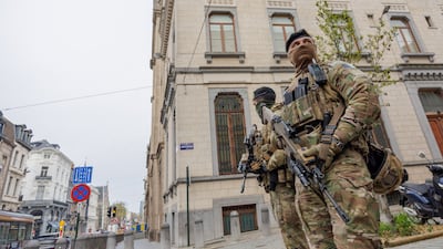 Belgian soldiers patrol a Jewish area of Liege after an attack on a synagogue in the city. EPA