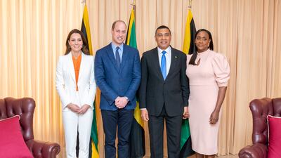 Prince William and Kate pose for a photograph with Mr Holness and his wife. Getty Images