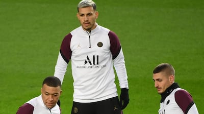 Paris Saint-Germain's forward Kylian Mbappe, midfielder Leandro Paredes and Marco Verratti attend a training session. AFP