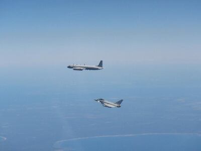 A Russian Coot A aircraft (top) is intercepted by a RAF Typhoon over Lithuania in June 2020. UK Ministry of Defence